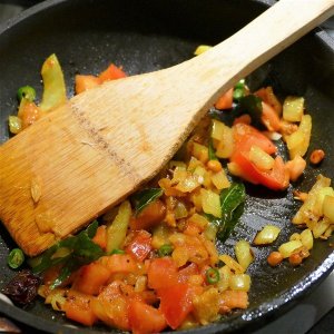 Adding vegetables to pan - Mini Masala Idli